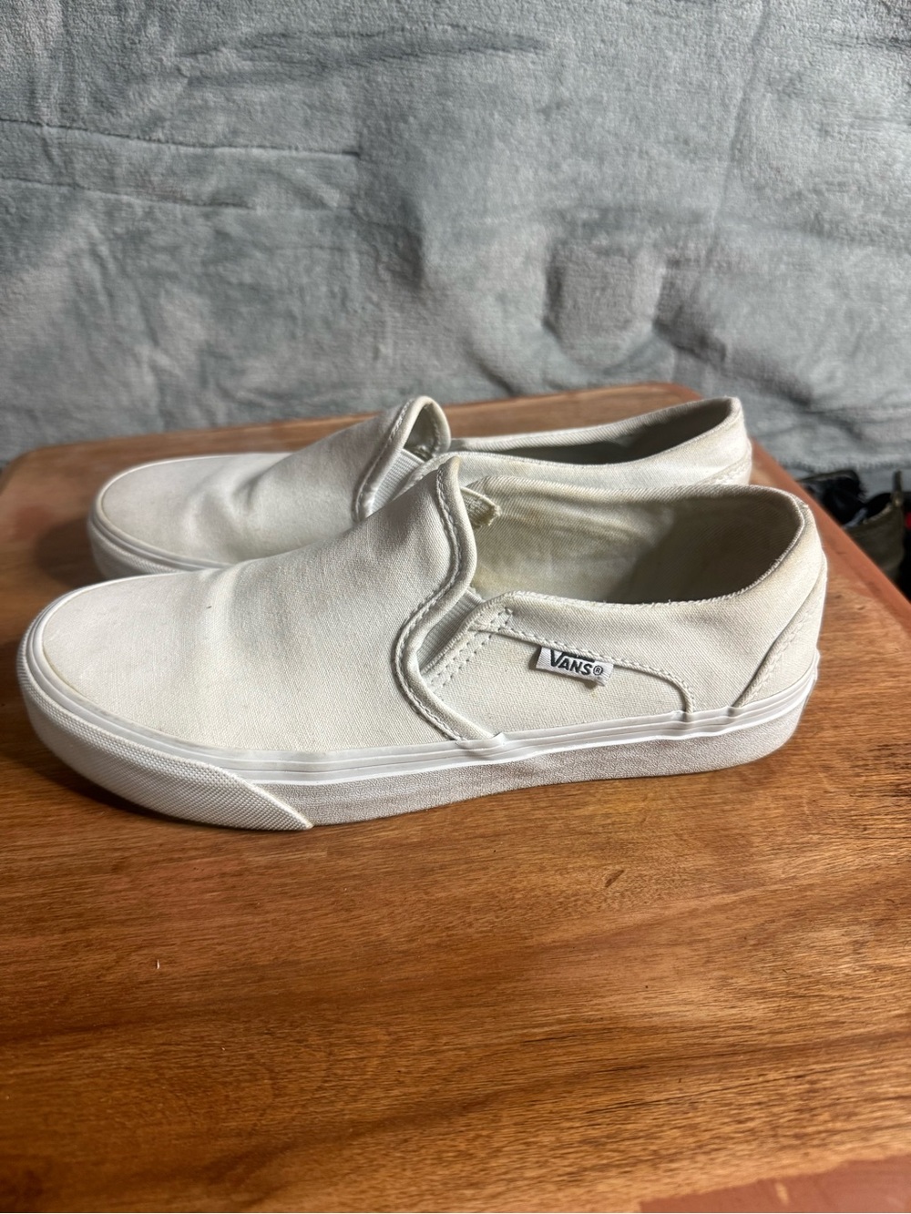 Vans women’s Classic Slip-On Canvas Sneakers in Off-White
